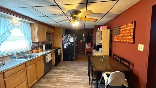 a large kitchen with kitchen island granite countertop lots of counter space