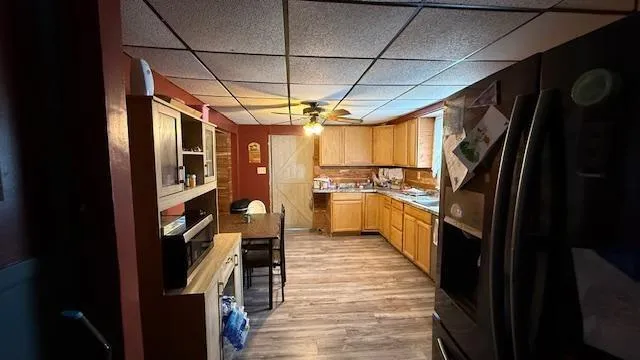 a view of a kitchen with a refrigerator