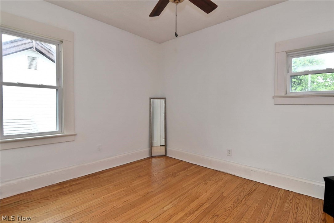 3584 Pennington Road Cleveland, OH 44120 - Photo 37 of 42 Unfurnished room with ceiling fan and light hardwood / wood-style flooring