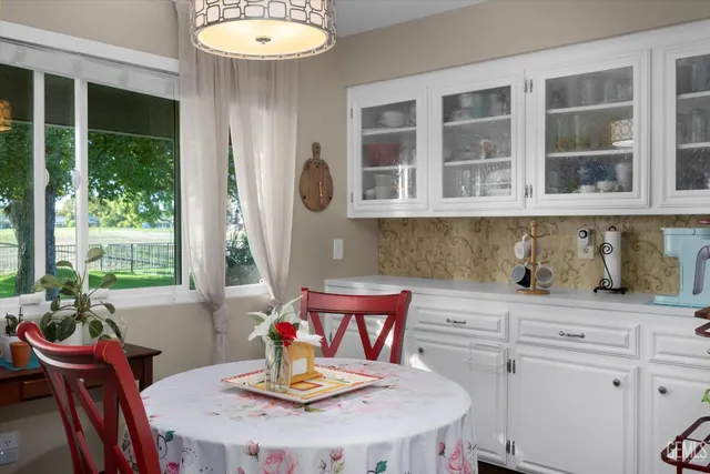 a view of a dining room with furniture window and outside view