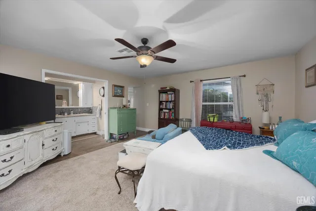 a bedroom with furniture and window