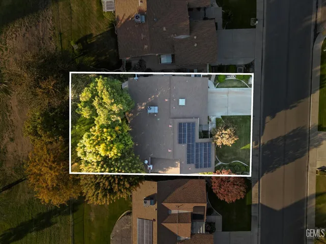 an aerial view of a house having yard swimming pool and outdoor seating