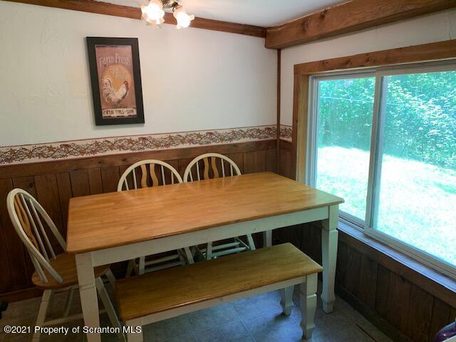 284 Carpenter Road Harveys Lake, PA 18612 - Photo 18 of 33 a view of a dining room with furniture window and outside view