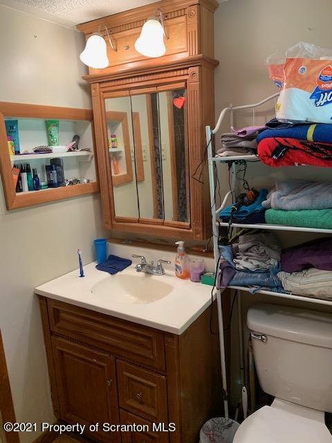 284 Carpenter Road Harveys Lake, PA 18612 - Photo 25 of 33 a bathroom with a sink and a mirror