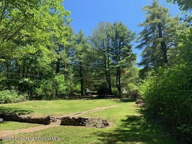 284 Carpenter Road Harveys Lake, PA 18612 - Photo 4 of 33 a view of a golf course with a trees