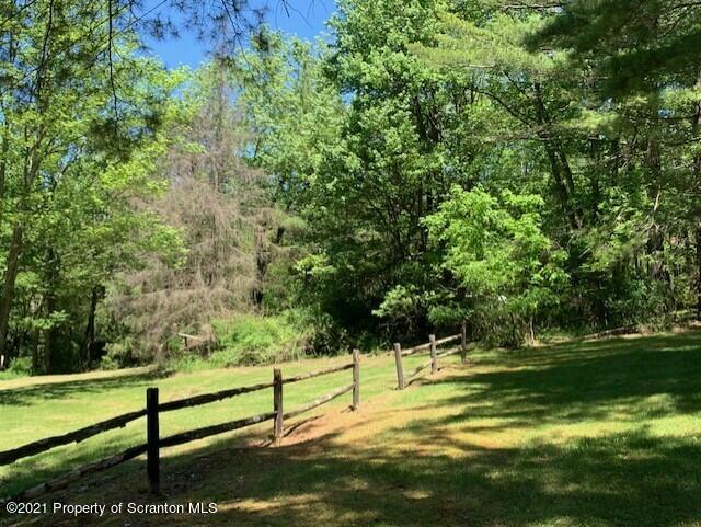 284 Carpenter Road Harveys Lake, PA 18612 - Photo 6 of 33 a view of a bench in a field