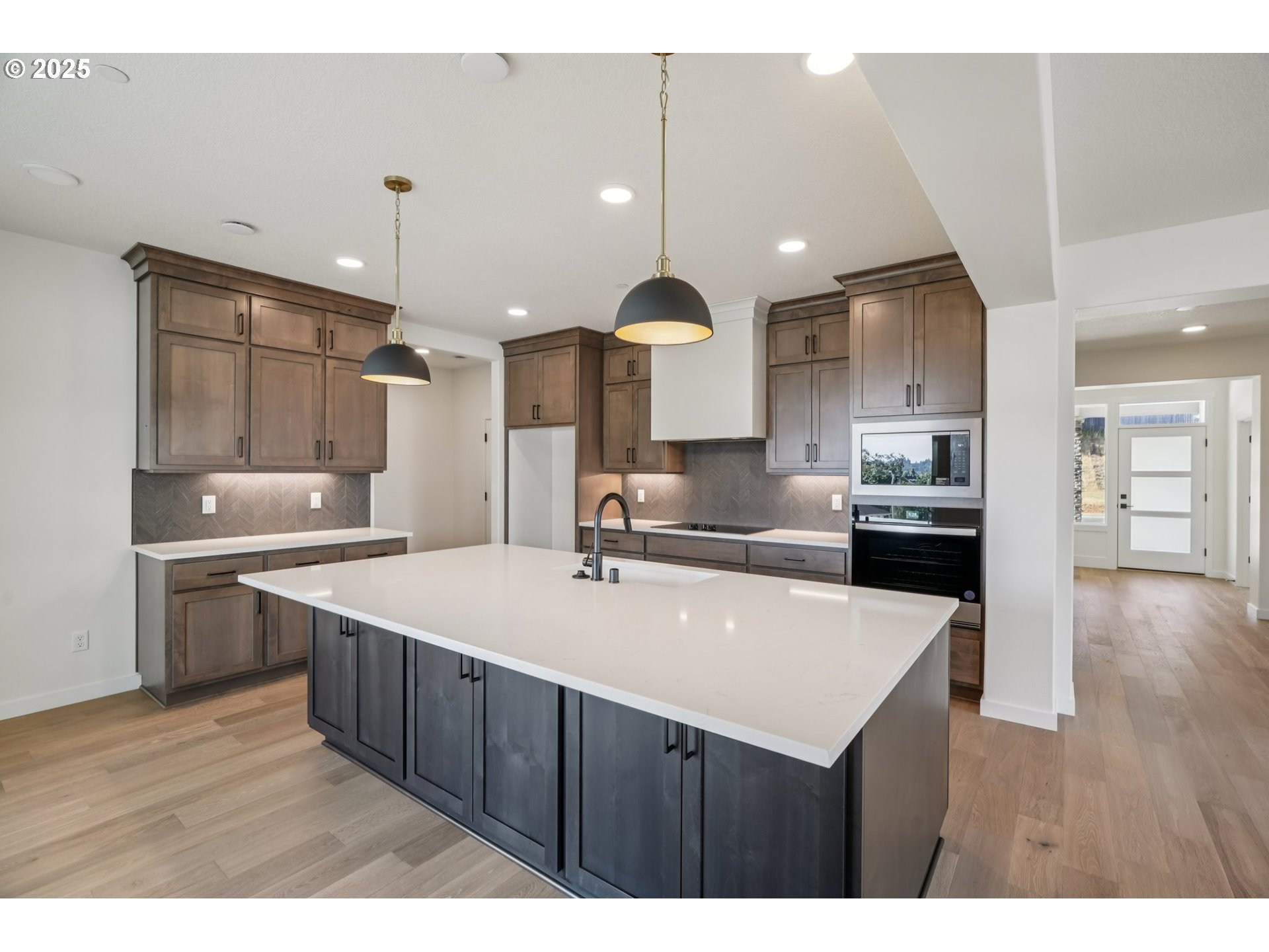410 West 20th Way La Center, WA 98629 - Photo 11 of 43 a kitchen with a sink a stove a refrigerator and a cabinets
