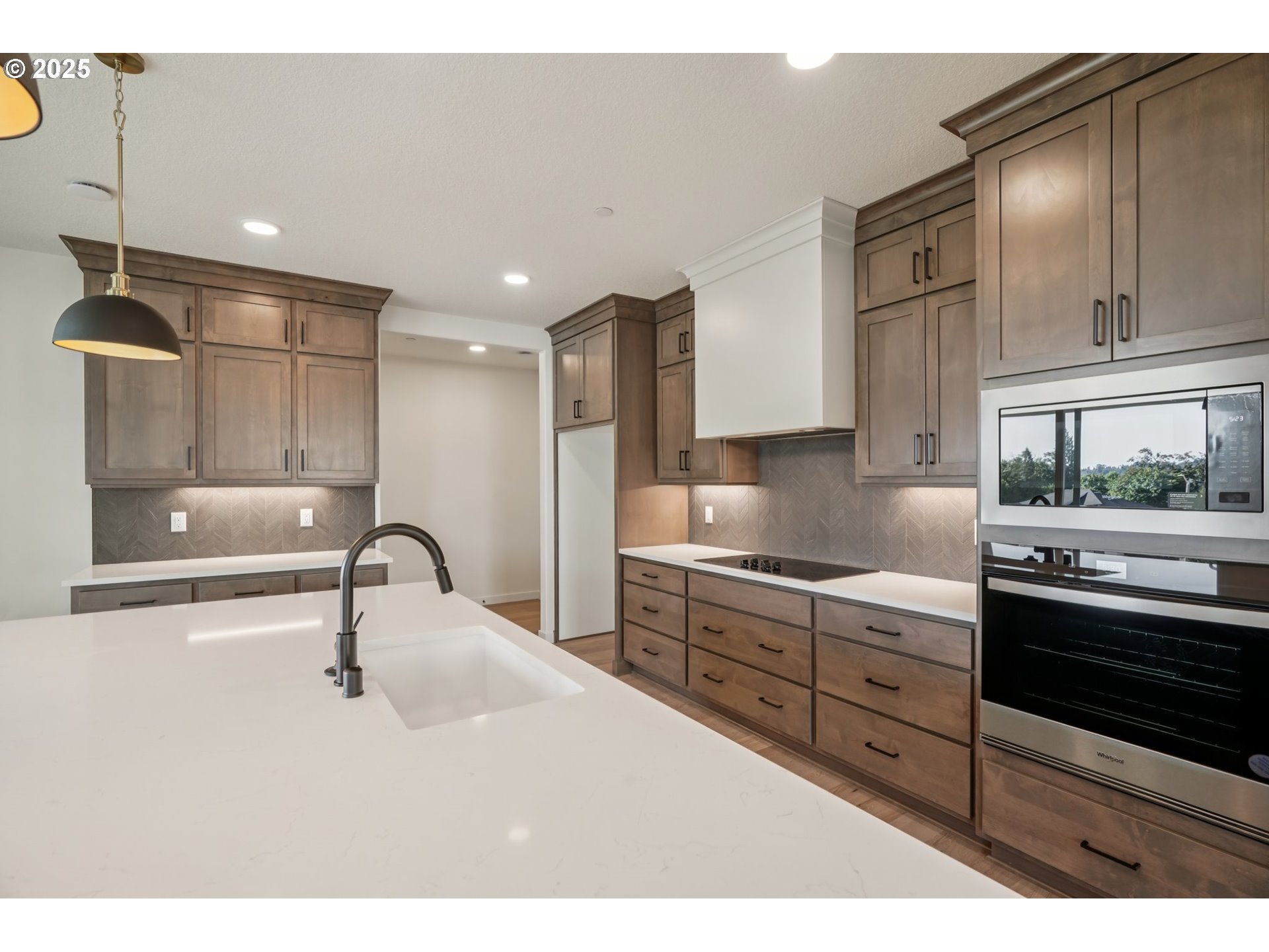 410 West 20th Way La Center, WA 98629 - Photo 15 of 43 a kitchen with stainless steel appliances kitchen island granite countertop a sink and cabinets