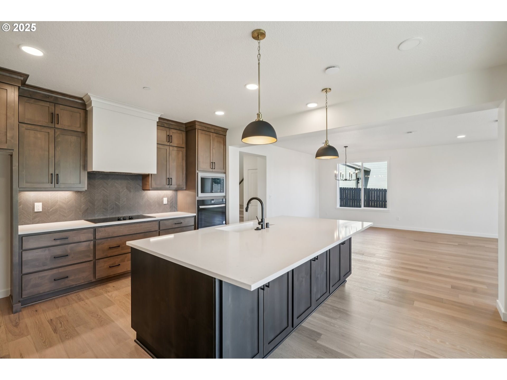 410 West 20th Way La Center, WA 98629 - Photo 17 of 43 a kitchen that has a lot of cabinets in it and wooden floors