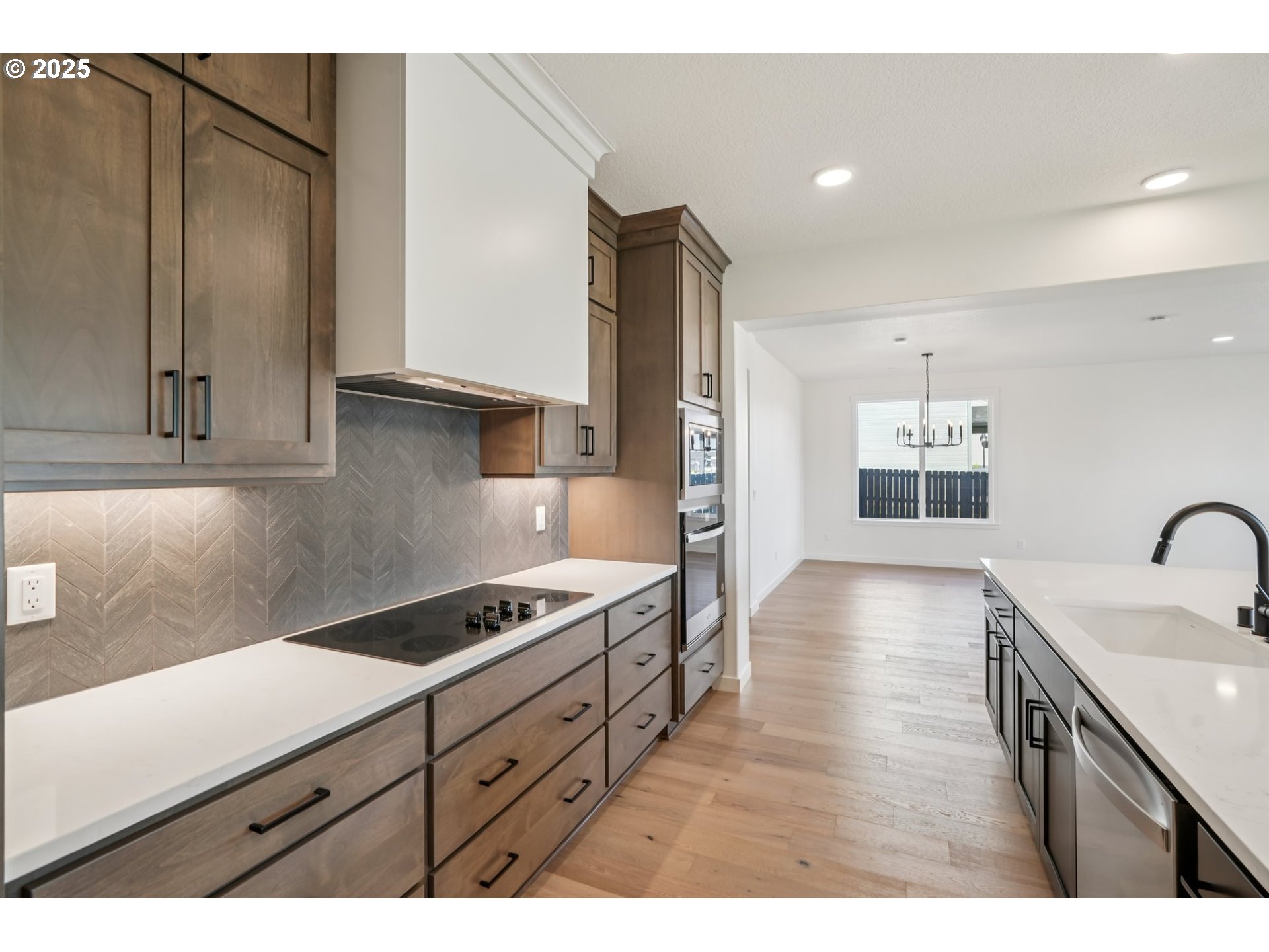410 West 20th Way La Center, WA 98629 - Photo 19 of 43 a kitchen with stainless steel appliances granite countertop a sink stove and refrigerator