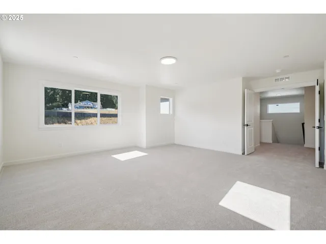 view of empty room with windows