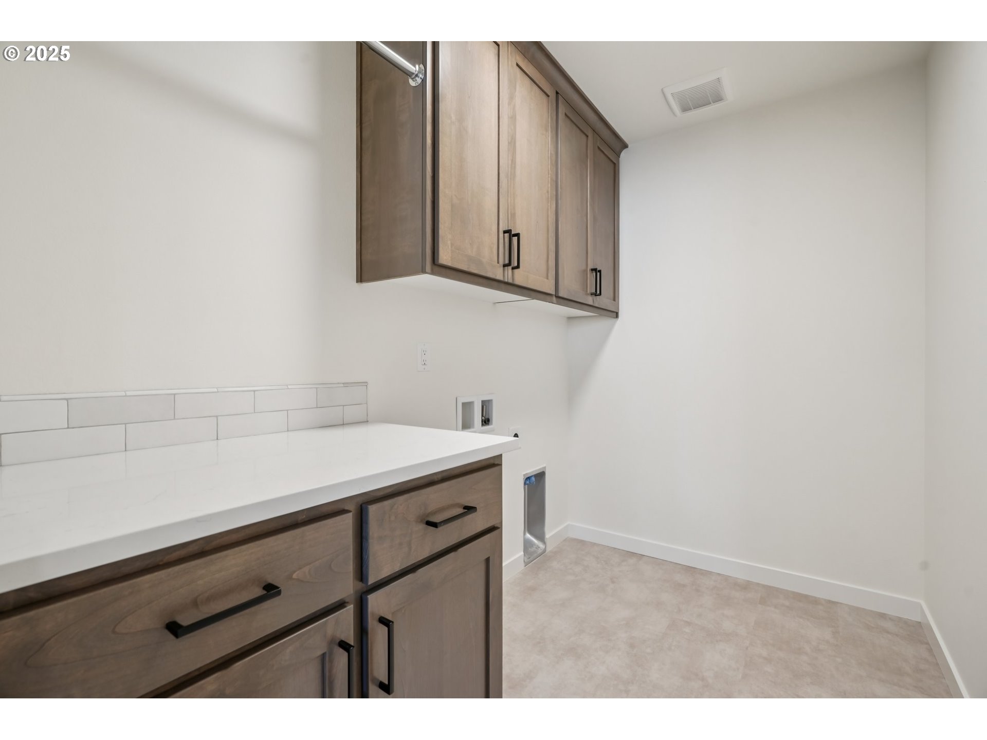 410 West 20th Way La Center, WA 98629 - Photo 33 of 43 a kitchen with a sink and cabinets