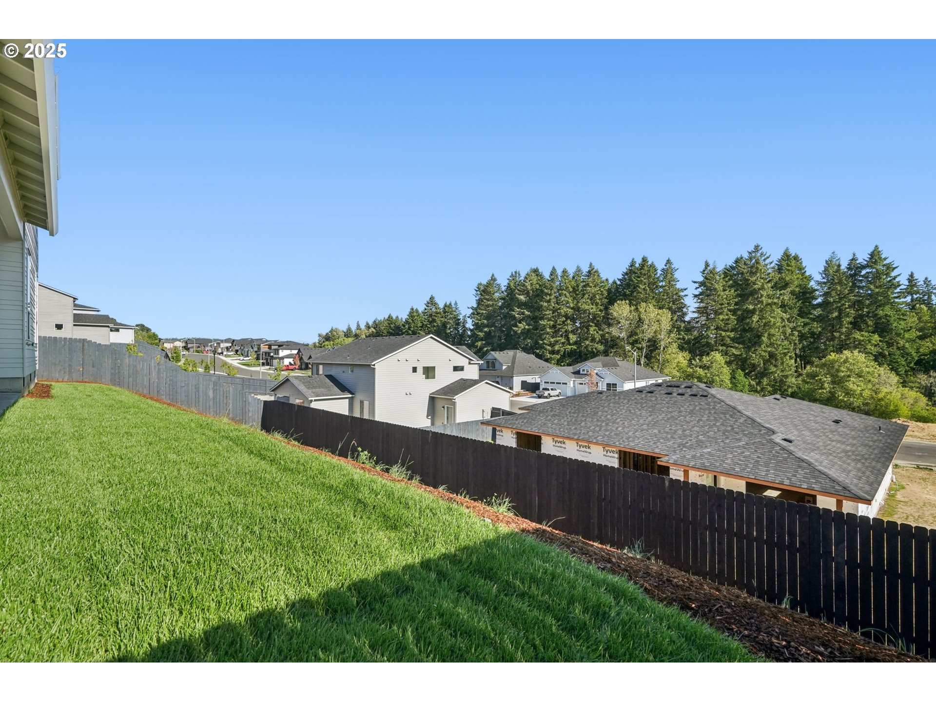 410 West 20th Way La Center, WA 98629 - Photo 39 of 43 a view of a house with a yard and wooden fence