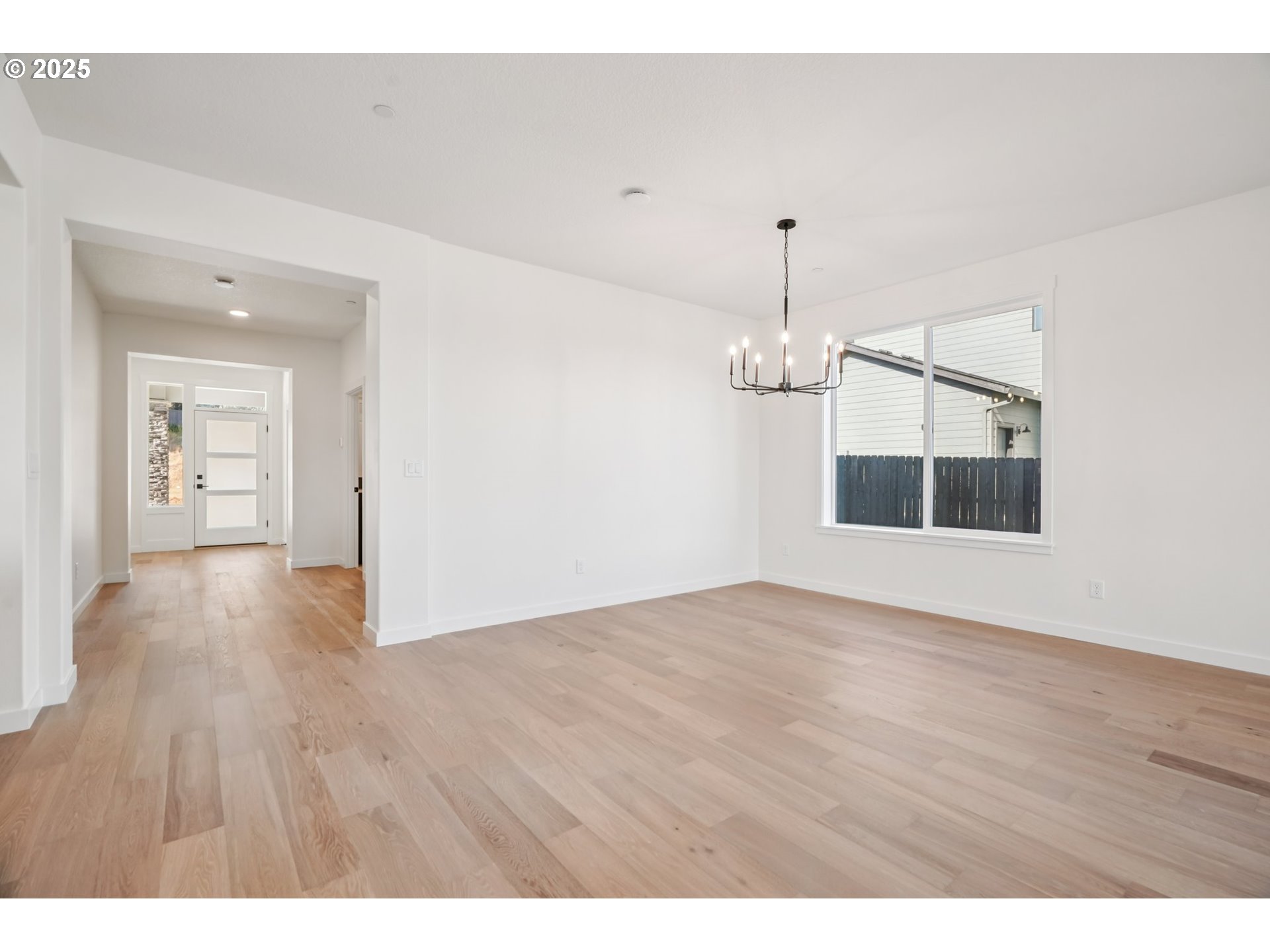410 West 20th Way La Center, WA 98629 - Photo 4 of 43 a view of an empty room with wooden floor