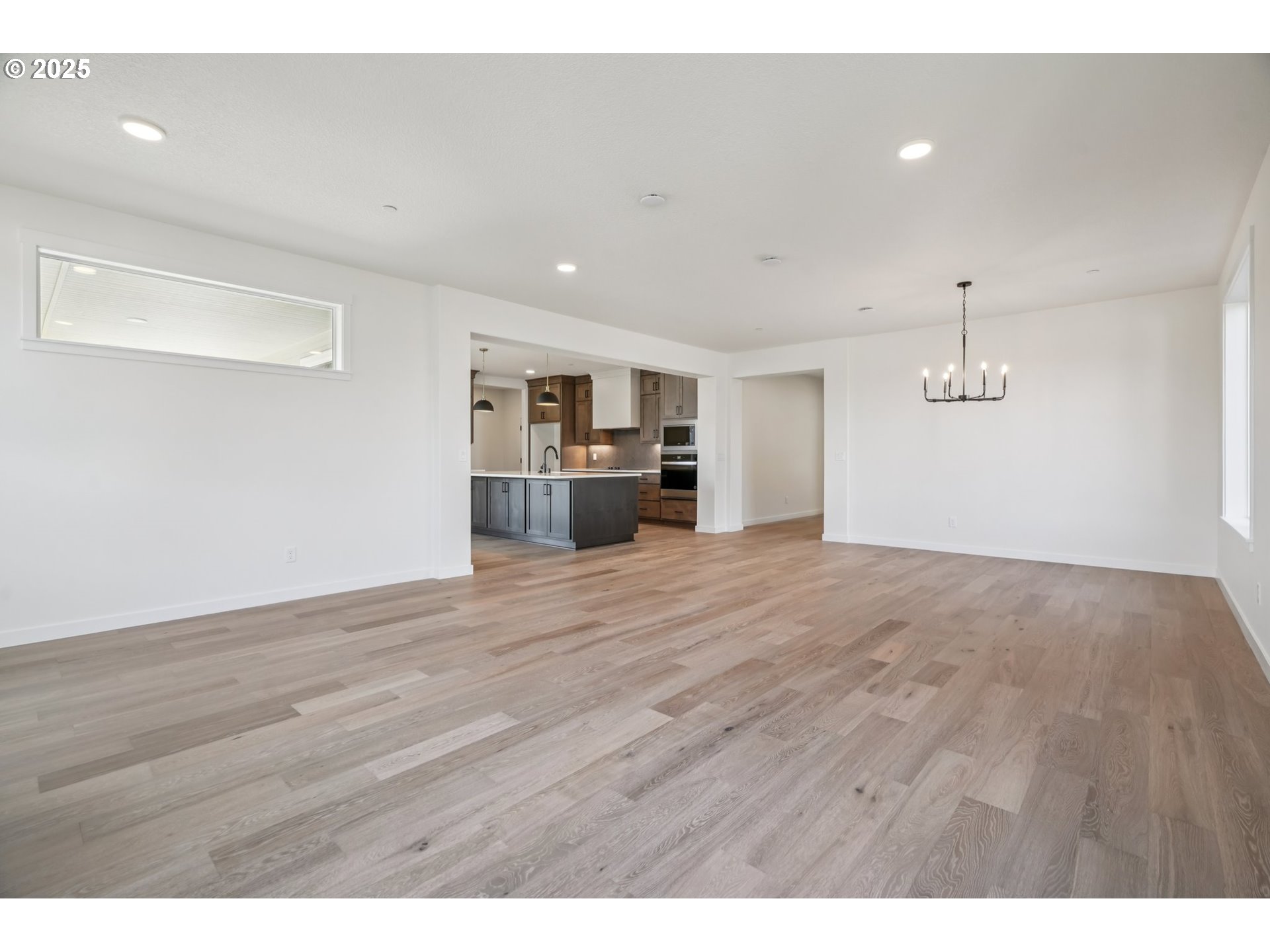 410 West 20th Way La Center, WA 98629 - Photo 8 of 43 a view of empty room with wooden floor