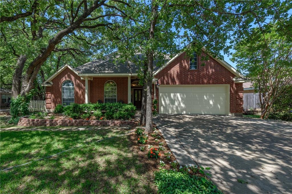 515 Addison Street Lake Dallas, TX 75065 - Photo 1 of 1 a front view of house with a garden