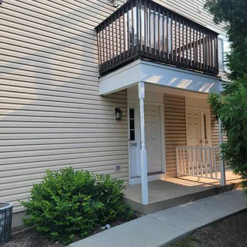 a front view of a house with garage