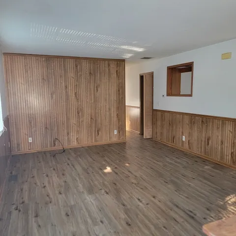 a view of a livingroom with wooden floor