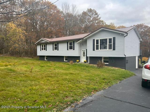 53 Elkview Drive, Unit 985 Forest City, PA 18421 - Photo 38 of 38 a front view of a house with a garden and yard