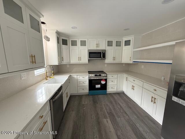 53 Elkview Drive, Unit 985 Forest City, PA 18421 - Photo 8 of 38 a white kitchen with stainless steel appliances granite countertop a stove and a sink
