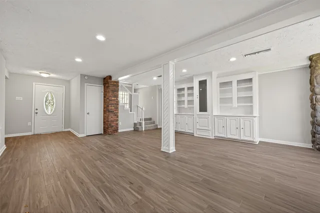 a view of a livingroom with wooden floor