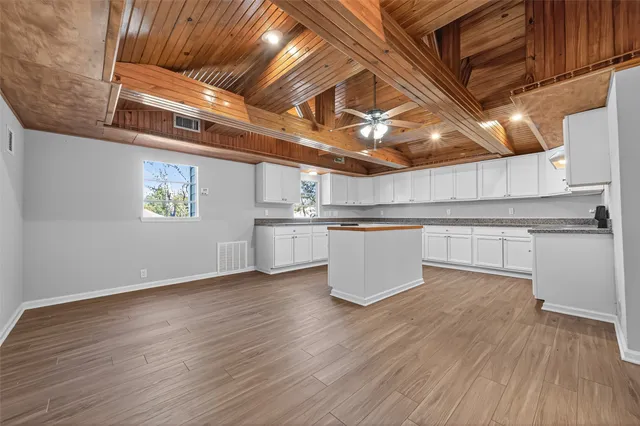 a view of a kitchen with wooden floor
