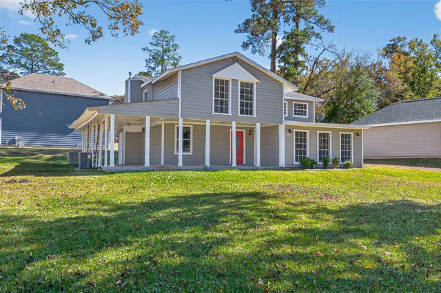 a view of a house with a garden and yard