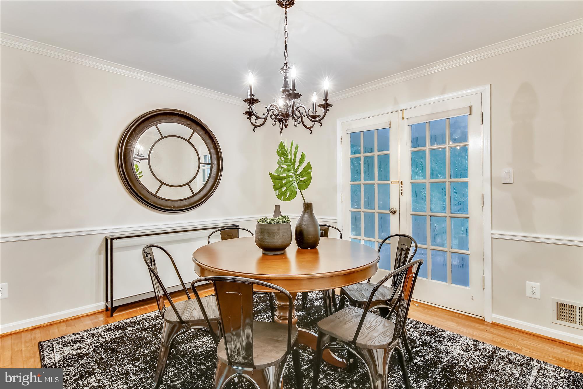 11407 Drop Forge Lane Reston, VA 20191 - Photo 14 of 48 a dining room with furniture and a chandelier