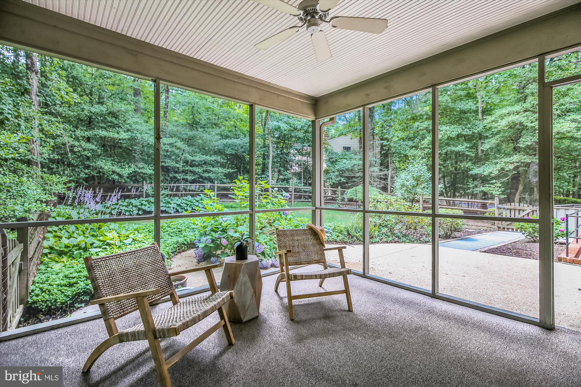 11407 Drop Forge Lane Reston, VA 20191 - Photo 23 of 48 a view of a patio with a table chairs and a backyard