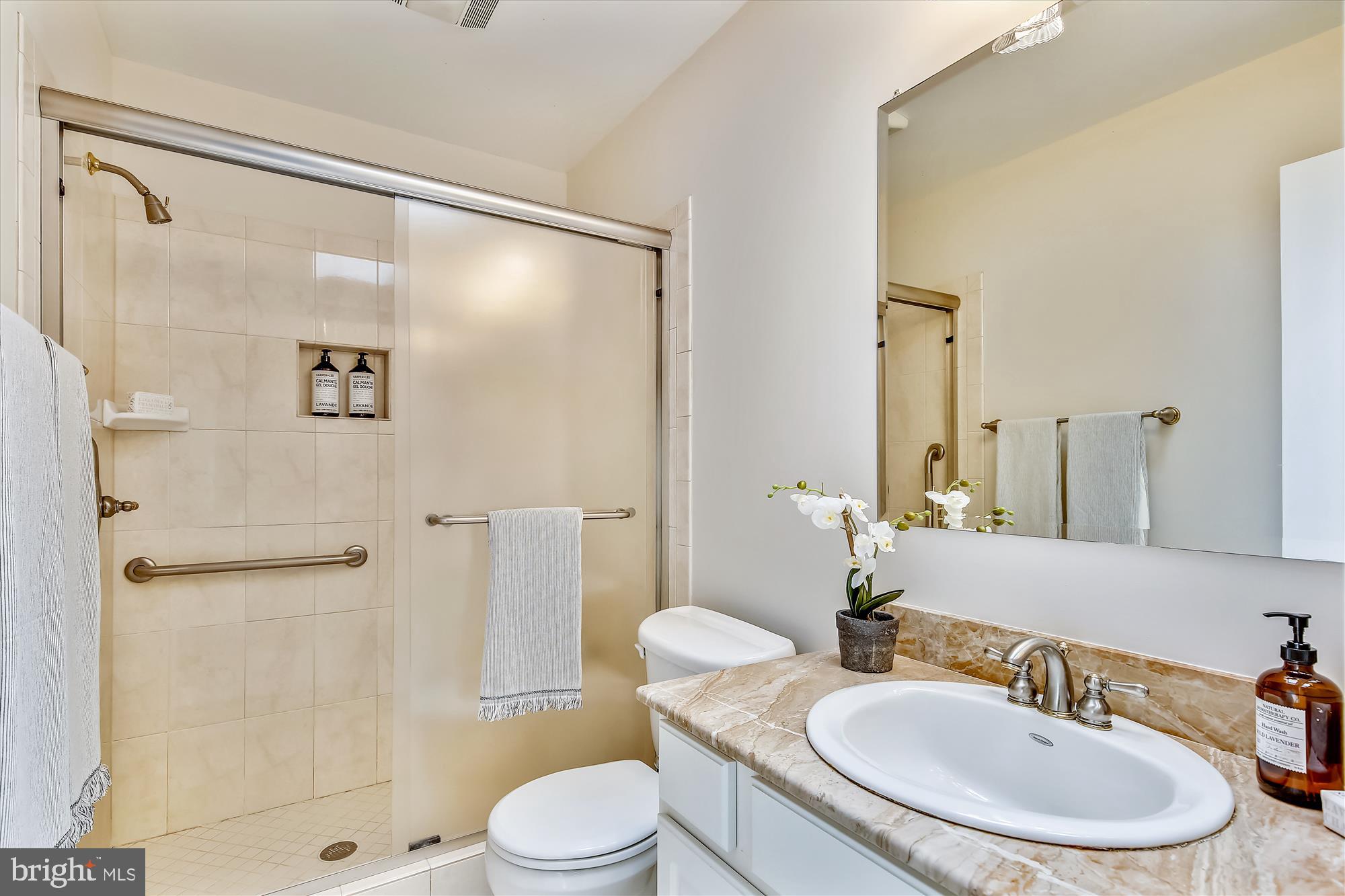 11407 Drop Forge Lane Reston, VA 20191 - Photo 31 of 48 a bathroom with a sink toilet and shower