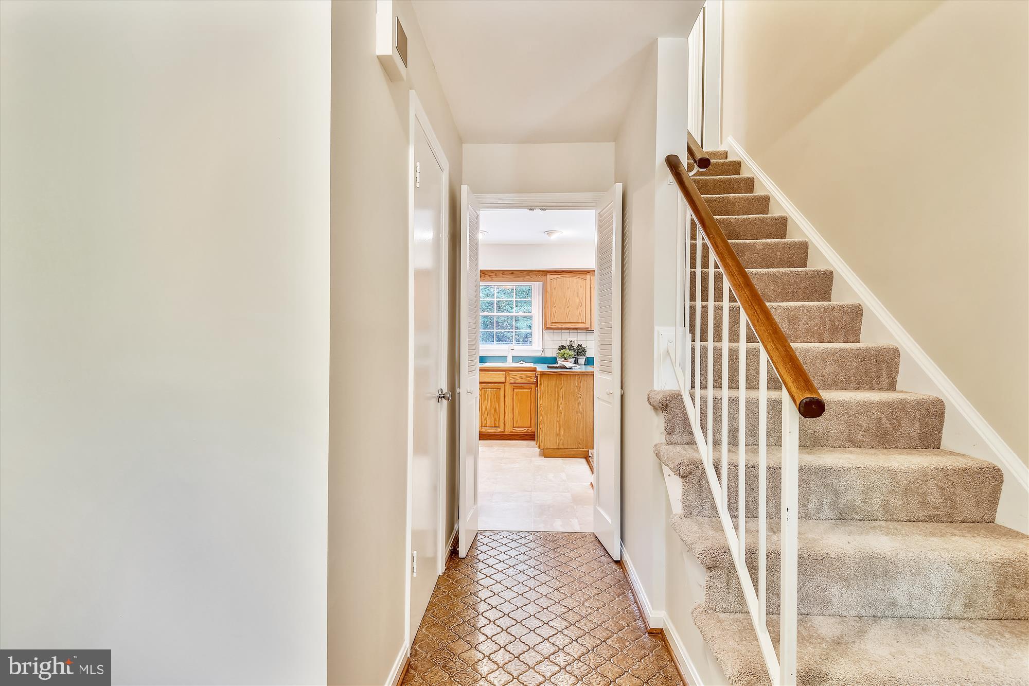 11407 Drop Forge Lane Reston, VA 20191 - Photo 6 of 48 a view of a hallway with wooden floor and entryway