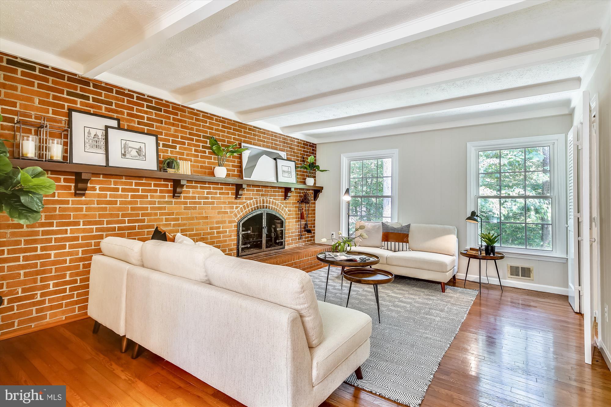 11407 Drop Forge Lane Reston, VA 20191 - Photo 8 of 48 a living room with furniture a fireplace and wooden floor