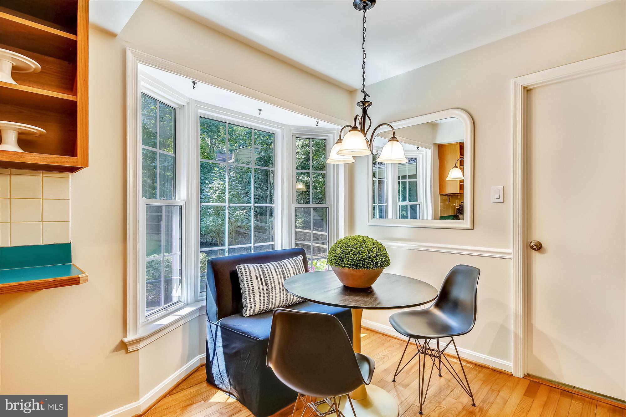 11407 Drop Forge Lane Reston, VA 20191 - Photo 10 of 48 a view of a dining room with furniture wooden floor and chandelier