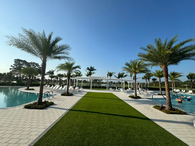 a view of swimming pool with a table and chairs