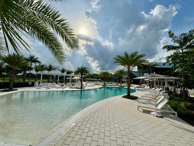 a view of a lake with couches in the patio