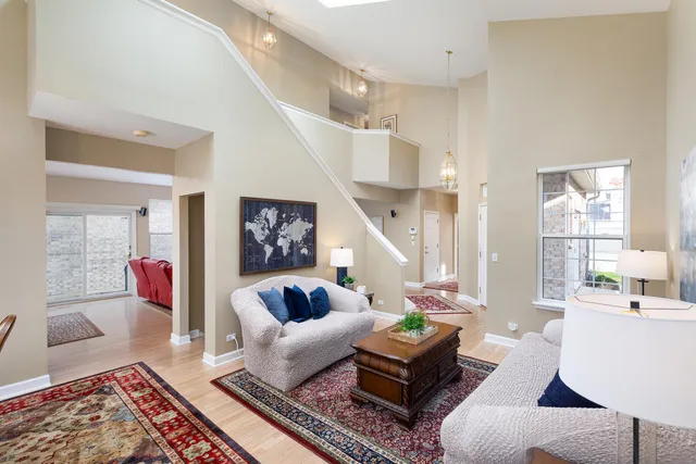 a living room with furniture and a rug