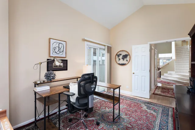 a view of a livingroom with furniture and a table