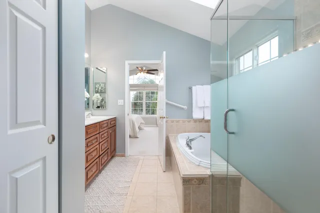 a bedroom with furniture and a window