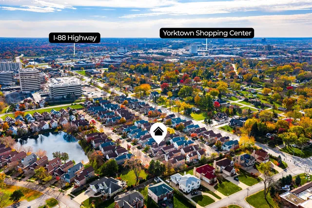 an aerial view of a house with a yard swimming pool and outdoor space