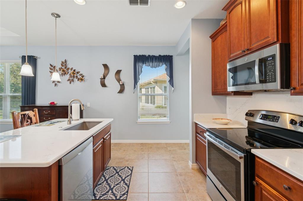1689 Trabuco Canyon Court Kissimmee, FL 34759 - Photo 13 of 52 a kitchen that has a sink and a stove top oven