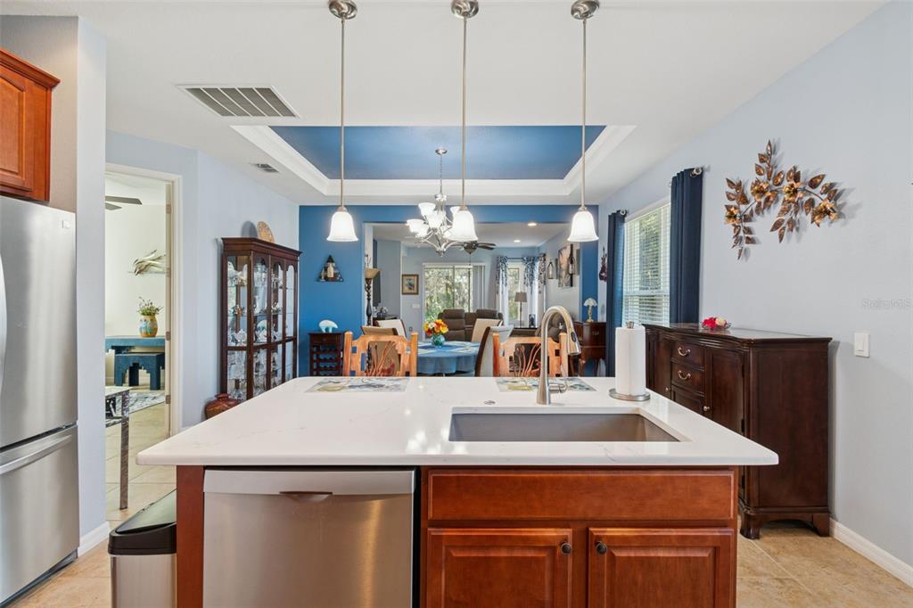 1689 Trabuco Canyon Court Kissimmee, FL 34759 - Photo 14 of 52 a kitchen with a counter top space a sink and a refrigerator
