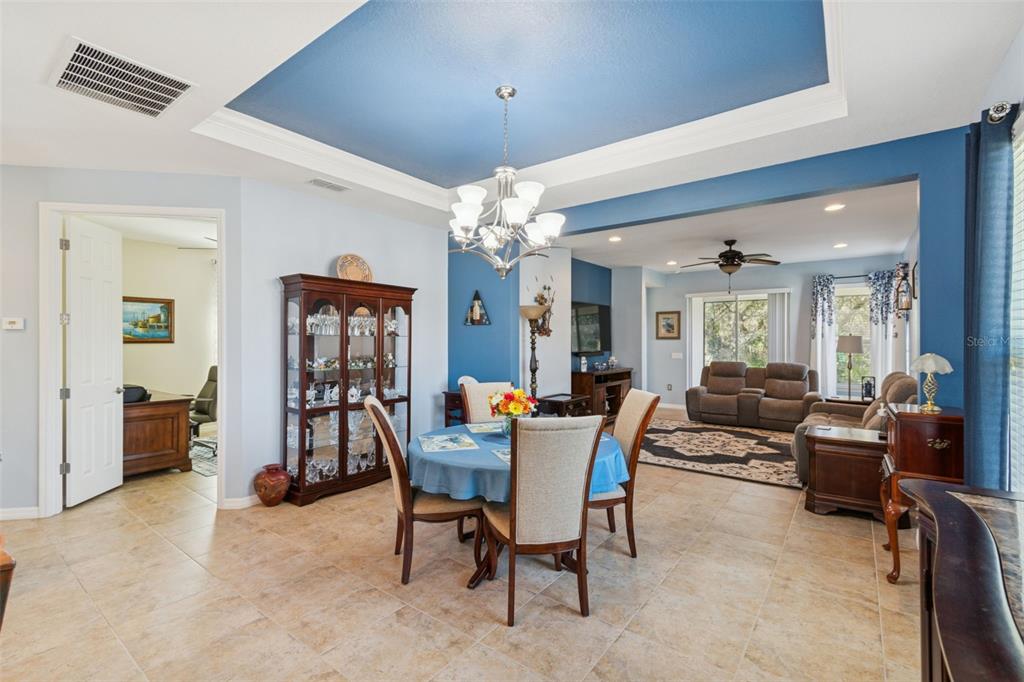 1689 Trabuco Canyon Court Kissimmee, FL 34759 - Photo 16 of 52 a dining room with furniture and window