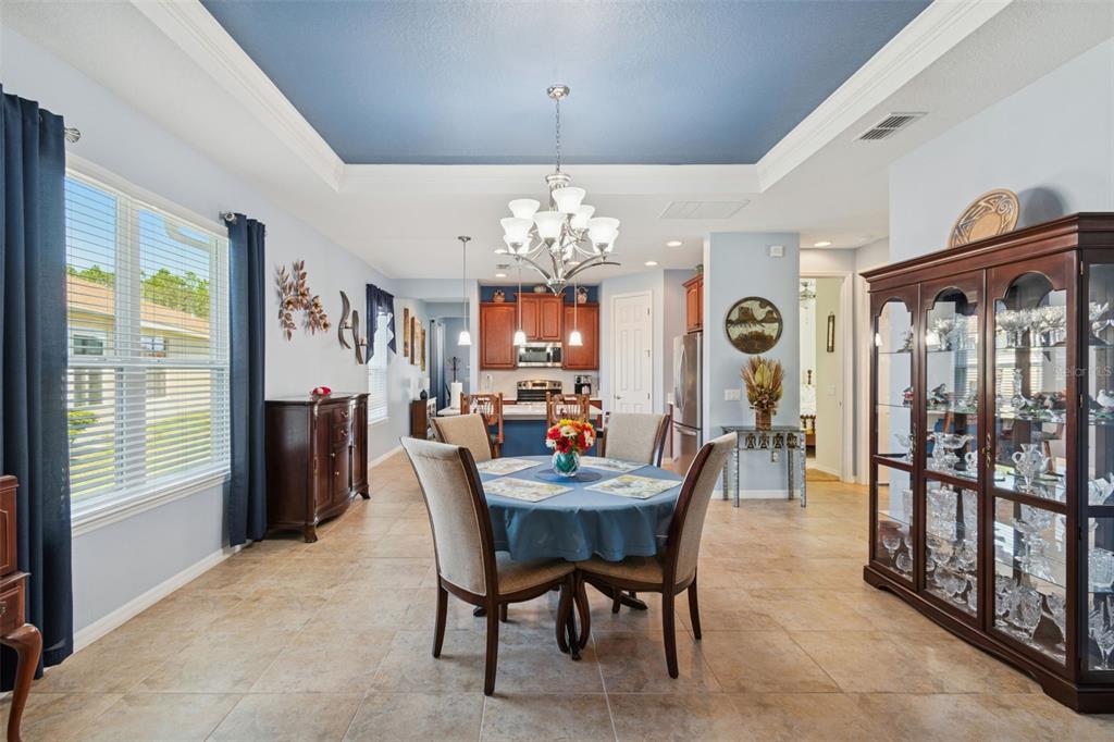 1689 Trabuco Canyon Court Kissimmee, FL 34759 - Photo 17 of 52 a view of a dining room with furniture window and outside view