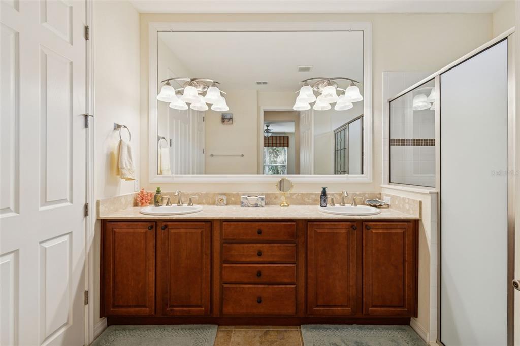 1689 Trabuco Canyon Court Kissimmee, FL 34759 - Photo 21 of 52 a bathroom with a double vanity sink and a mirror