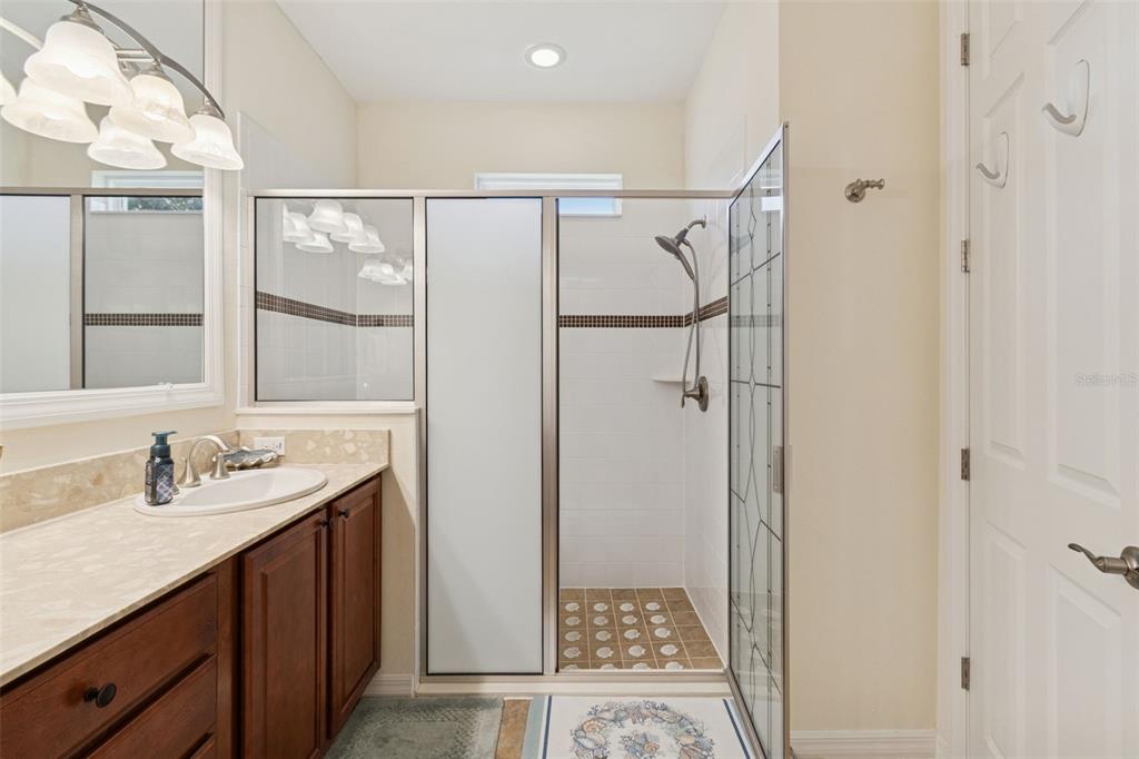 1689 Trabuco Canyon Court Kissimmee, FL 34759 - Photo 23 of 52 a bathroom with a sink and a mirror