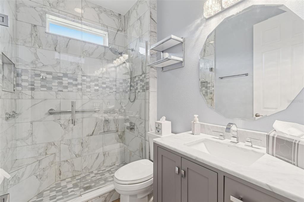 1689 Trabuco Canyon Court Kissimmee, FL 34759 - Photo 27 of 52 a bathroom with a sink vanity granite toilet and shower