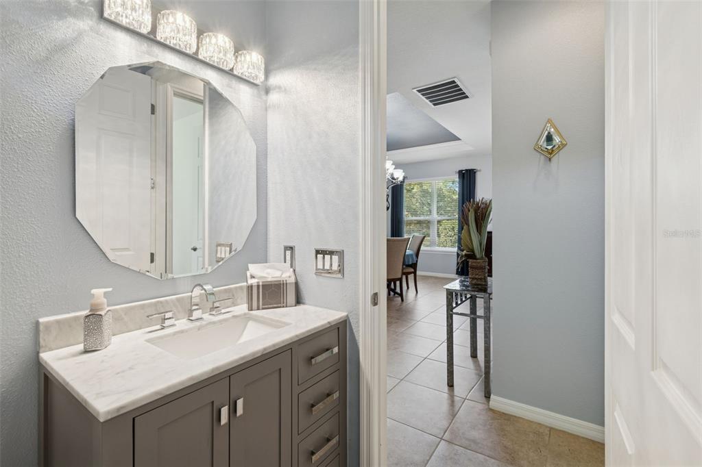 1689 Trabuco Canyon Court Kissimmee, FL 34759 - Photo 28 of 52 a en suite bathroom with a sink double vanity and a mirror