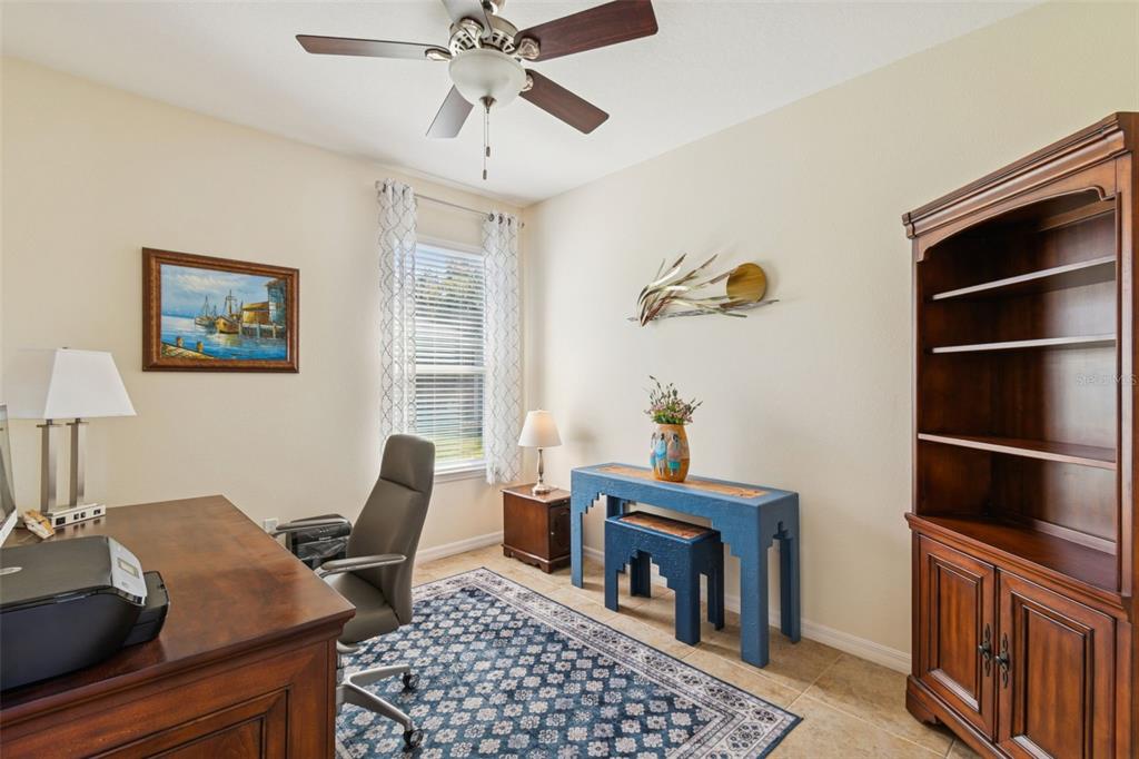 1689 Trabuco Canyon Court Kissimmee, FL 34759 - Photo 30 of 52 a view of a workspace with furniture and a window