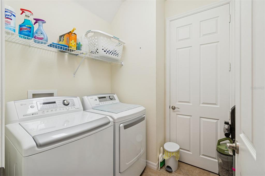 1689 Trabuco Canyon Court Kissimmee, FL 34759 - Photo 31 of 52 a utility room with dryer and washer