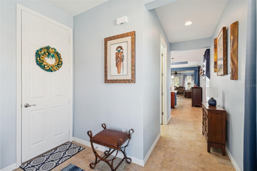 1689 Trabuco Canyon Court Kissimmee, FL 34759 - Photo 4 of 52 a view of a hallway to a livingroom with furniture